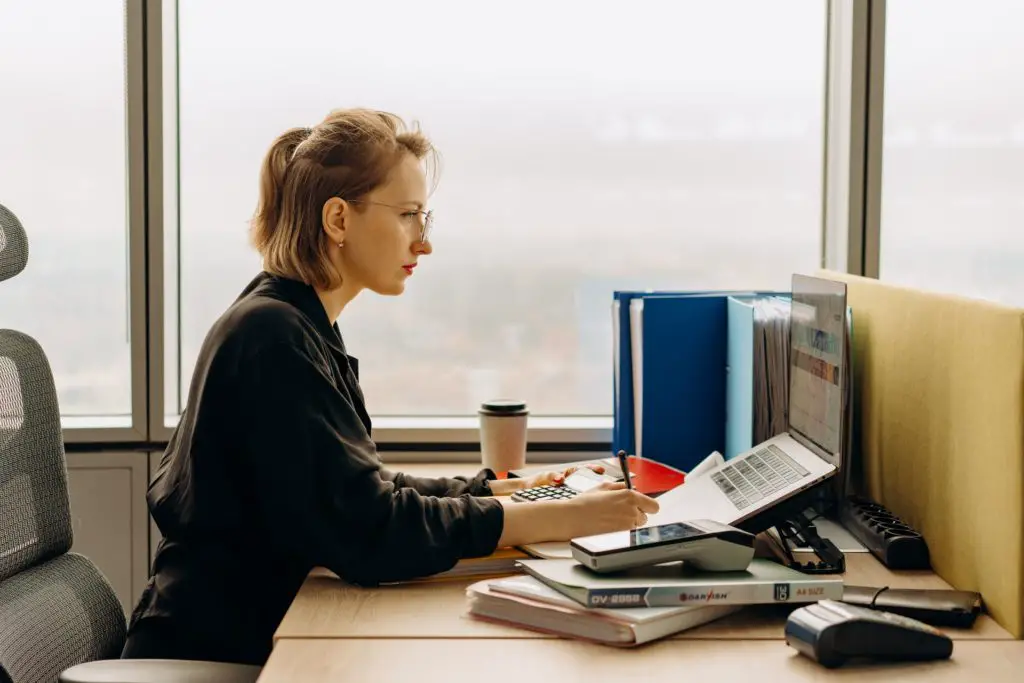 Female accountant in front of laptop on her work desk